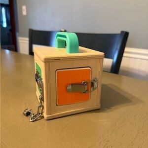 Wooden Lock Box Toy with Orange and Green Accents